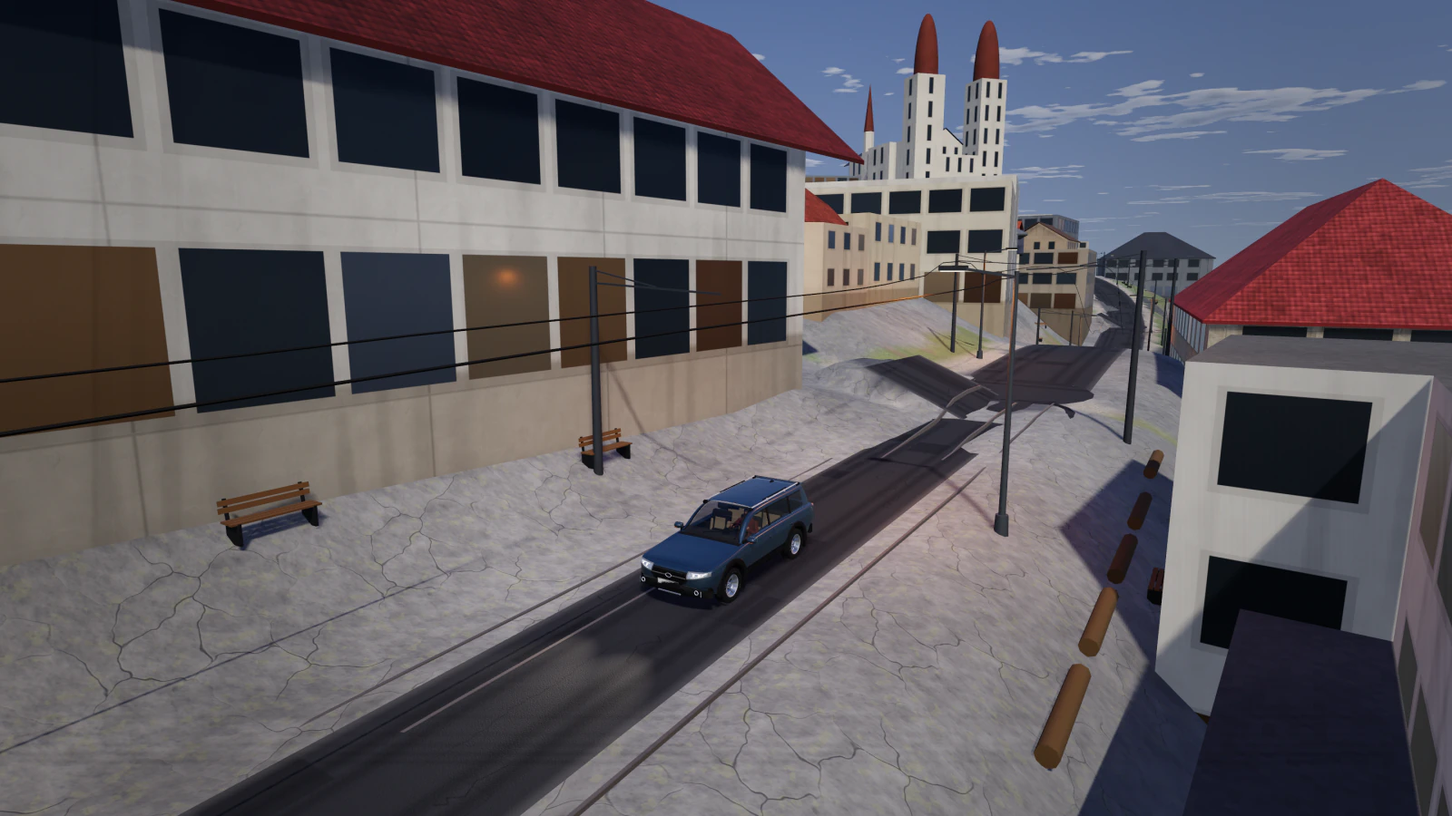 A blue Halden Estate on a Zürich old-town street with tram wires, the twin towers of the Grossmünster ahead